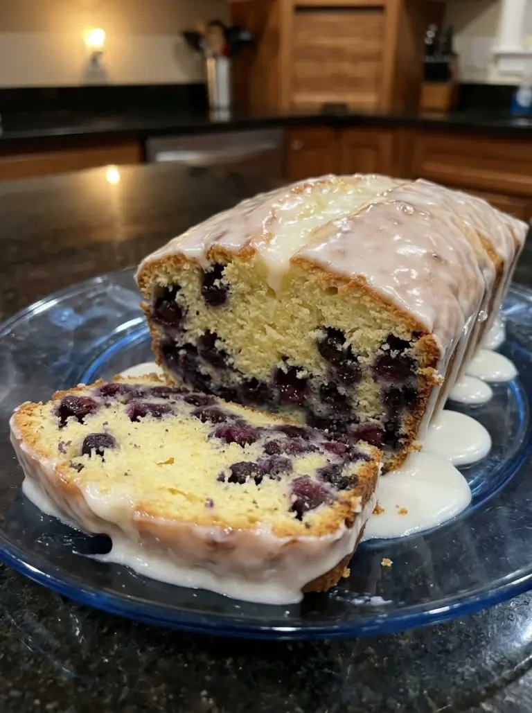 Delicious lemon blueberry bread with fresh blueberries and a sweet glaze.